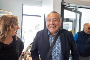 Man laughing and chatting with Chana Martineau