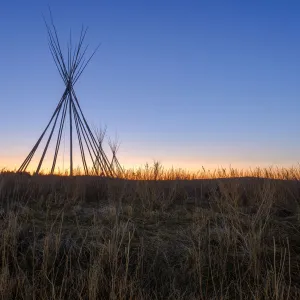 Tipi wooden frame in morning dawn glow